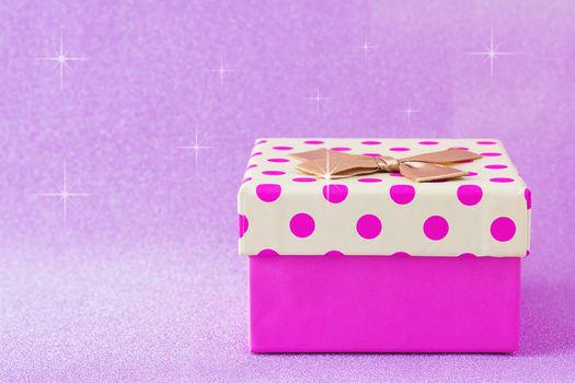 Colorful gift box on pink background, christmas, happy new year, birthday, valentine concept