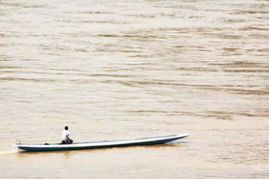 Man ride the boat on the river blur background, Asian lifestyle concept 