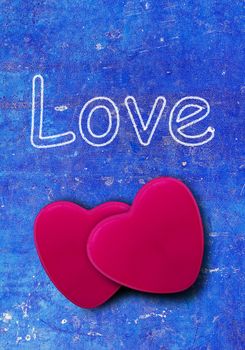 Red heart on blue vintage background with love text, love, valentine and wedding concept