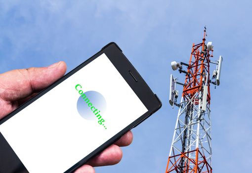 Mobile phone connecting to broadcast tower, telecommunication concept