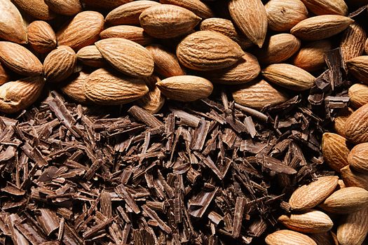 Almond nuts and delicious grated chocolate closeup