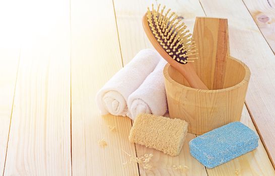 Spa equipment set on wood table and sunlight, treatment concept