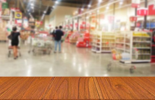 Wood table in supermarket or shopping mall, montage or display product concept