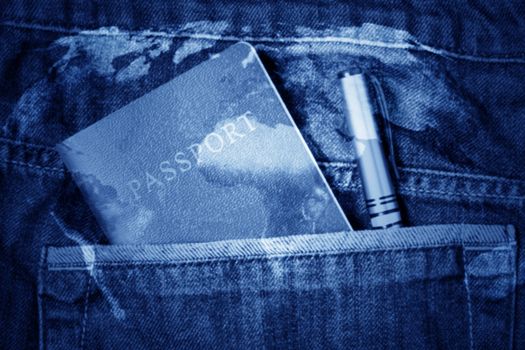 Traveling concept blur background, passport and pen in blue jean pocket, double exposure, Elements of this image furnished by NASA