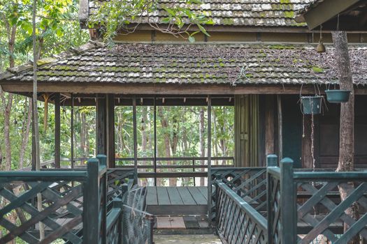 wooden terrace balcony of traditional Thai house in garden