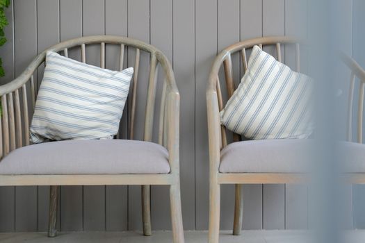 striped pillow cushion on wooden chair in living room. home interior