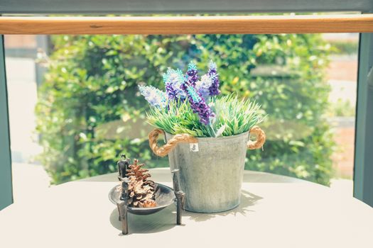 plant flower in metal tin bucket decorating in living room home interior