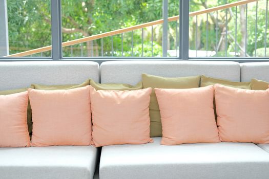 orange pillow on chair sofa couch in living room. home apartment interior