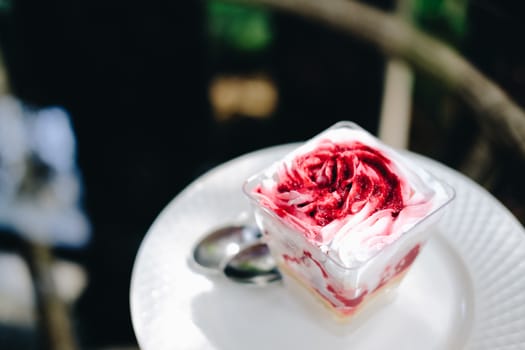 strawberry cream cheesecake in plastic cup. homemade dessert