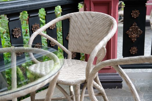brown wicker rattan chair on terrace balcony patio in cafe restaurant hotel resort