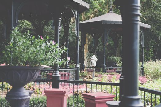 gazebo pavilion for resting in garden park. tranquil nature scene