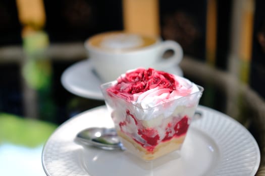 strawberry cream cheesecake in plastic cup. homemade dessert