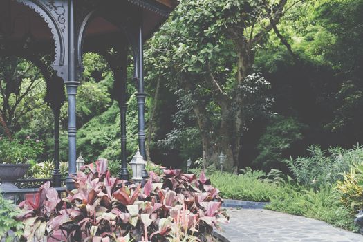 gazebo pavilion for resting in garden park. tranquil nature scene