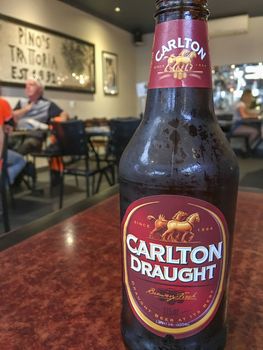 PHILLIP ISLAND, AUSTRALIA - NOVEMBER 2015: Carlton Draught beer bottle in a local restaurant.