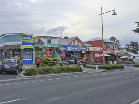 PHILLIP ISLAND, AUSTRALIA - NOVEMBER 2015: Street and shop in Cowes at sunset.