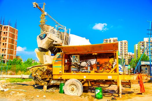 Delhi, India - October 2018: cement mixer working near the big constructions area in Delhi