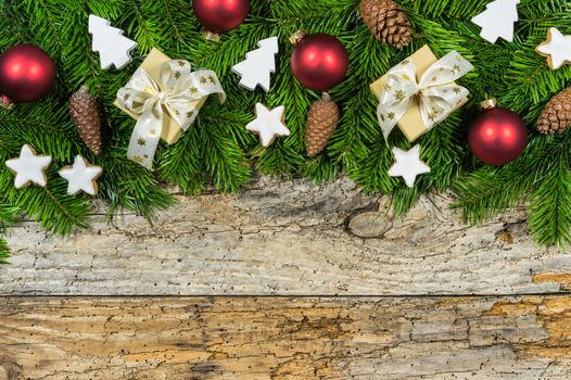 Xmas wood background with christmas presents and traditional decoration with copy space