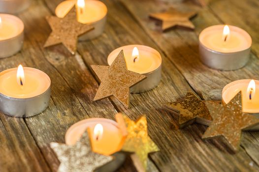 Festive Christmas and Advent candle with star shape ornaments