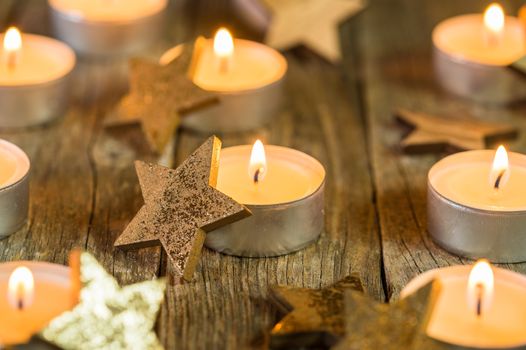 Advent candles composition with golden star shape decorations