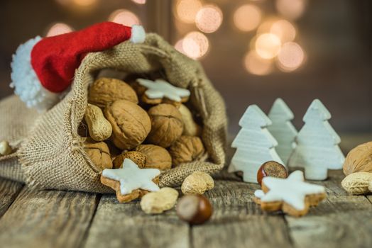 Advent and Christmas composition with food, sweets, christmas ornaments and blurred lights background