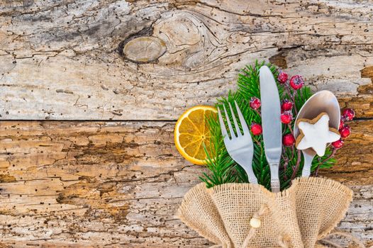 Christmas cutlery on wooden table, holidays season celebration background, copy space