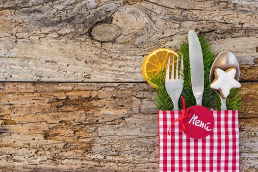 Christmas dinner cutlery with tag and spanish word menú, means menu