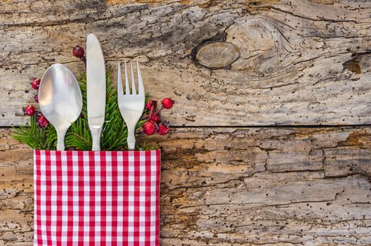 Christmas dinner meal cutlery on rustic wooden table background, copy space