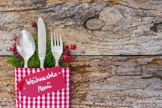 Christmas dinner cutlery, with tag and german text, Weihnachts-Menue, means christmas menu