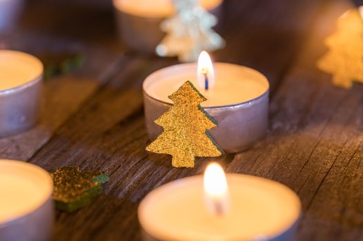 Festive christmas mood with burning candle flames and ornaments