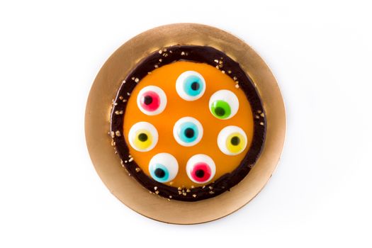 Halloween cake with candy eyes decoration isolated on white background.
