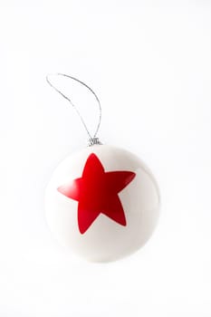 White Christmas ball with red star isolated on white background