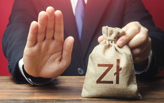 Businessman refuses to give polish zloty money bag. Loan refusal, bad credit history. Asset freeze. Stop financing projects and reforms, crisis financial difficulties. Payment refund. Deception, fraud