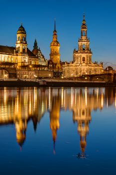 The towers of Dresden at dawn reflecting in the River Elbe