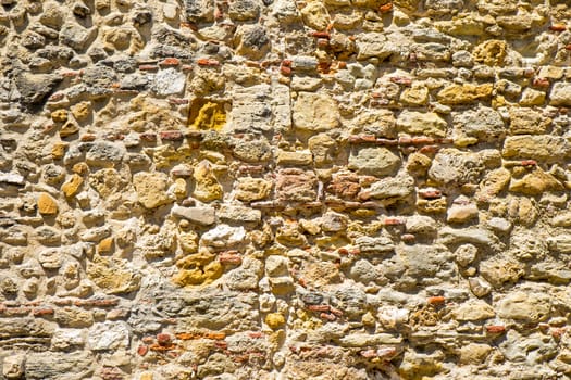 Background from an old natural brown stonewall