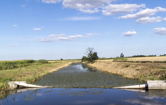 The railing and sluice regulate the water.