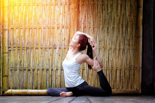 Woman yoga in nature bamboo background