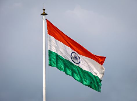 National flag of country India, unfurled and flying in the air on a clear background.