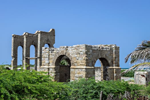Remains of stone made Dhanushkodi railway station and its water tank. The railway line was abandoned as the station and rails were destroyed in a heavy cyclone in the area in 1964.