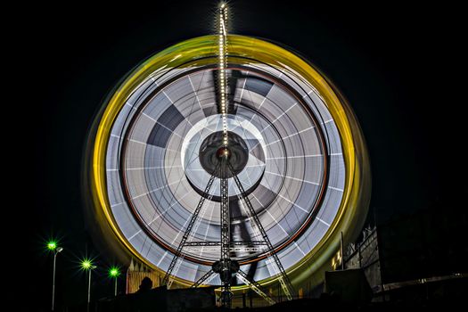 Slow shutter, night image of a spinning giant wheel in funfair in Pune, Maharashtra, india.