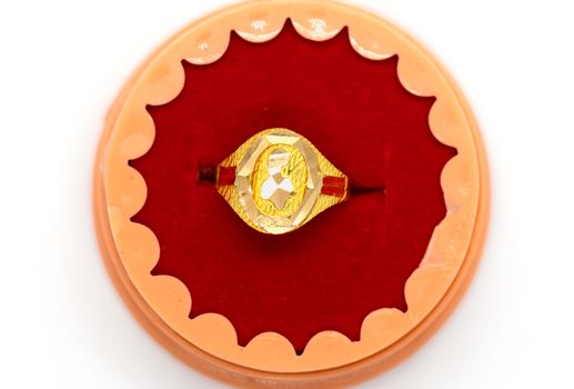 gold ring on the box with white background