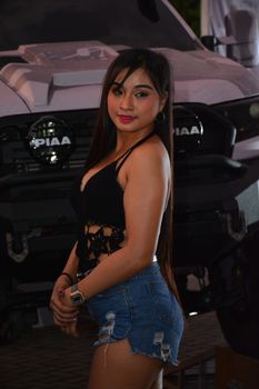 PASAY, PH - DEC. 7: Car show female model at Bumper to Bumper 15 on December 7, 2019 in Mall of Asia Concert Grounds, Pasay, Philippines. Bumper to Bumper is a annual aftermarket car show event in the Philippines.