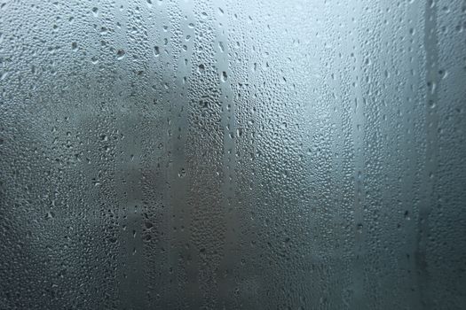 Bright grey color glassy texture, with water drops on it. Water drop glassy background