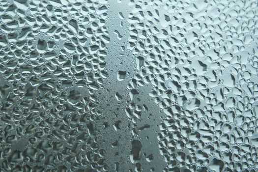 Bright grey color glassy texture, with water drops on it. Water drop glassy background