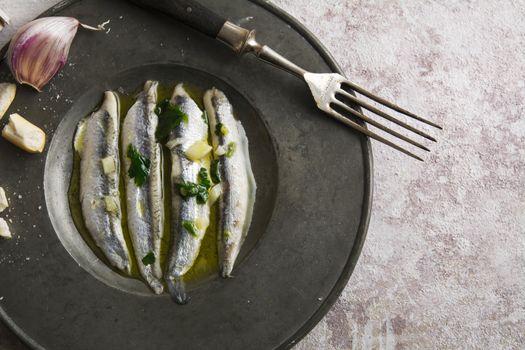 anchovies in vinegar with garlic and olive oil