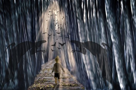 Horror background for Halloween concept. Kid walking alone on path in mystic dark forest.