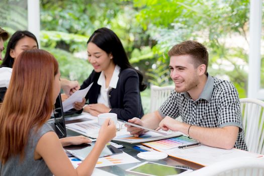 young business people making meeting and talking for analyzing marketing working at office on desk.