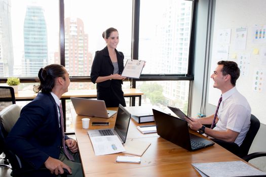 businesswoman presentation to a group in meeting.