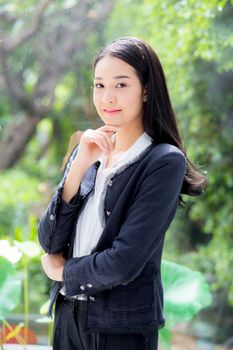 business woman in the office looking happy and smiling.