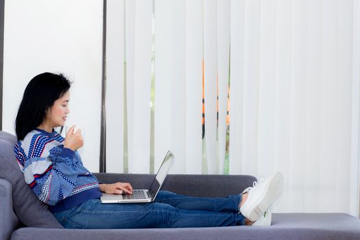 computer notebook on sofa with asian woman for work in lifestyle of woman concept