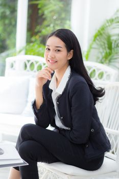 business woman in the office looking happy and smiling.